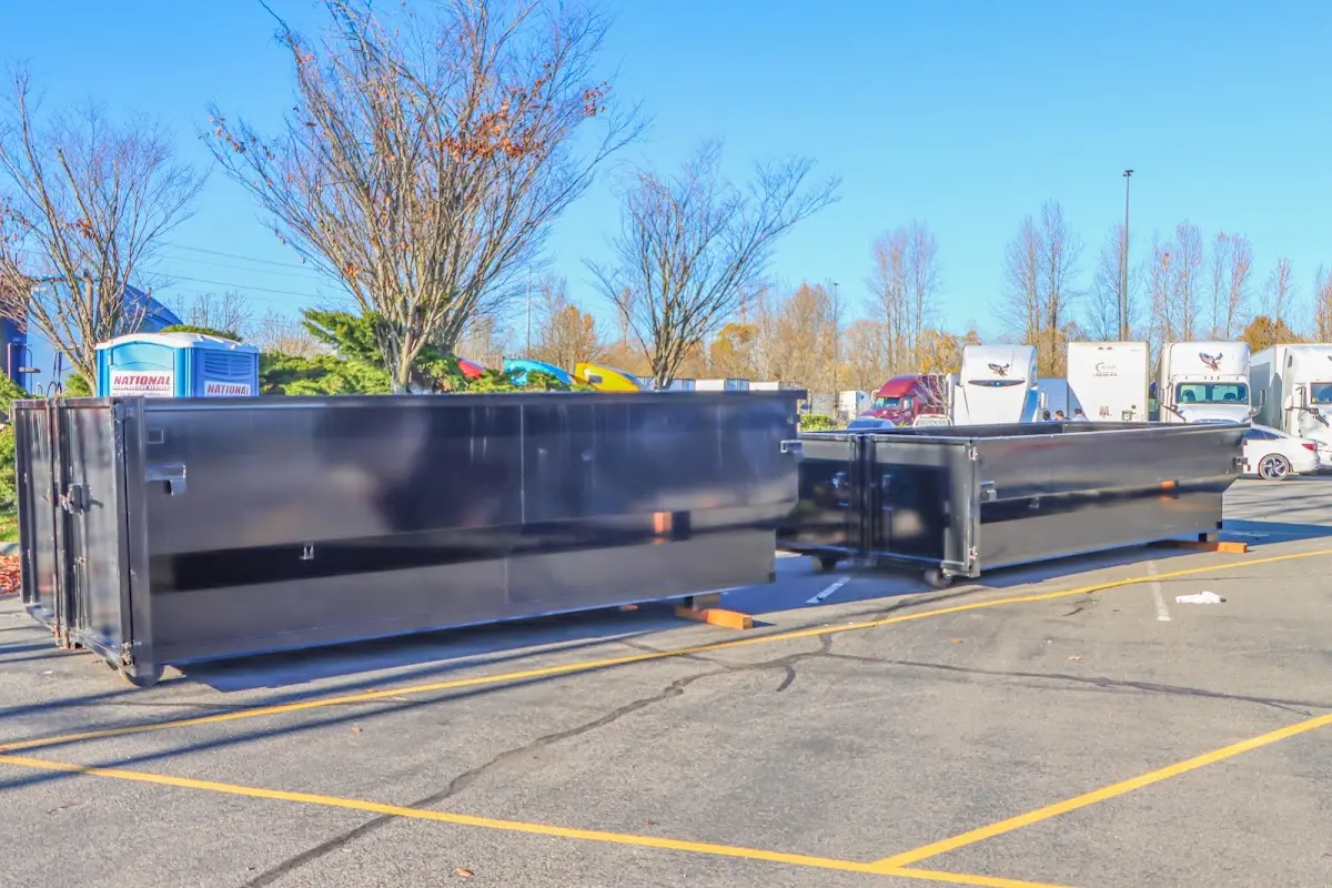 Professional dumpster rental service with roll-off container on residential driveway in Darlington